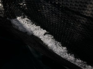A line of thick ice along the rim of a trampoline