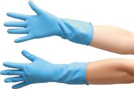 Hands outstretched covered in blue, rubber gloves