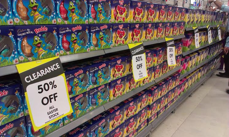 A shopping aisle filled with discounted chocolate Easter eggs